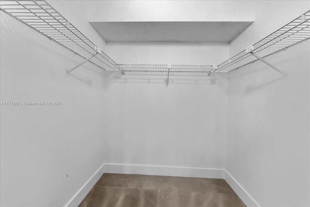 650 SW 124th Ter Unit 105P, Pembroke Pines, FL 33027 - walk in closet featuring tile patterned flooring