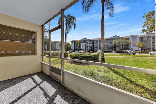 650 SW 124th Ter Unit 105P, Pembroke Pines, FL 33027 - unfurnished sunroom featuring a residential view and healthy amount of natural light