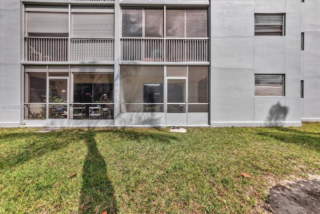 650 SW 124th Ter Unit 105P, Pembroke Pines, FL 33027 - back of property featuring a lawn and a sunroom