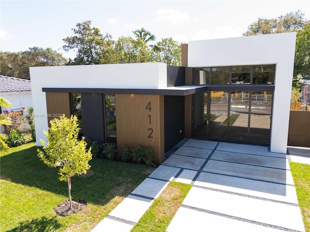 modern home with a front yard