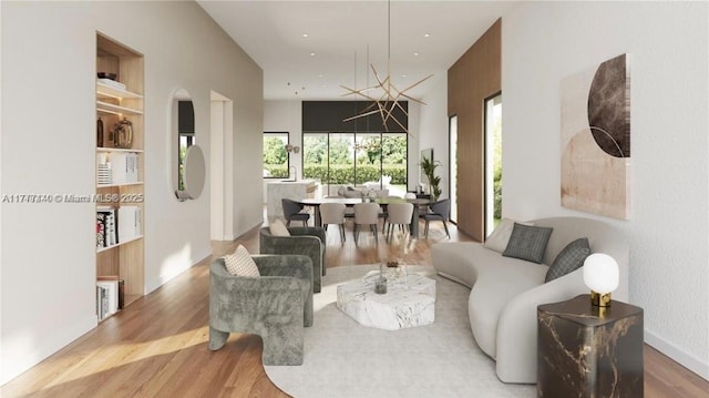 living area with built in shelves, wood finished floors, and a healthy amount of sunlight