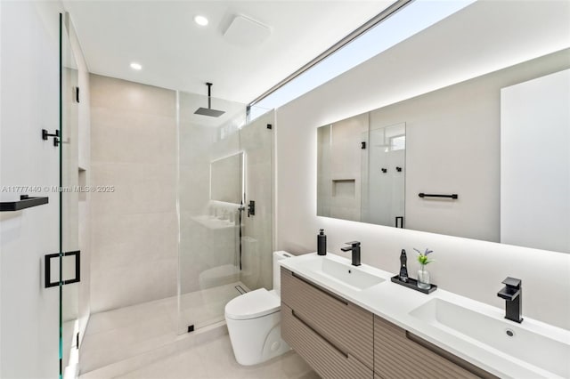 full bath featuring toilet, a sink, a stall shower, and recessed lighting