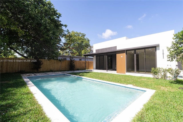 view of pool featuring a fenced in pool, a fenced backyard, and a yard