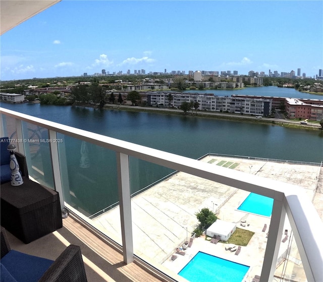 1301 NE Miami Gardens Dr Unit 1115W, Miami, FL 33179 - balcony featuring a skyline view, view of pool area, and a water view