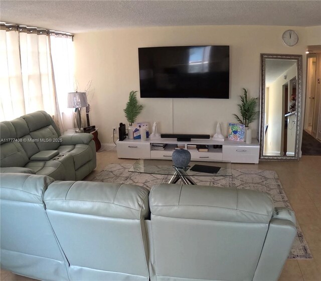 1301 NE Miami Gardens Dr Unit 1115W, Miami, FL 33179 - tiled living room featuring a textured ceiling