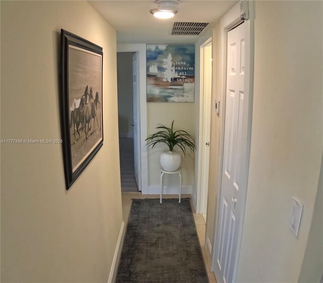 1301 NE Miami Gardens Dr Unit 1115W, Miami, FL 33179 - hallway with baseboards and wood finished floors
