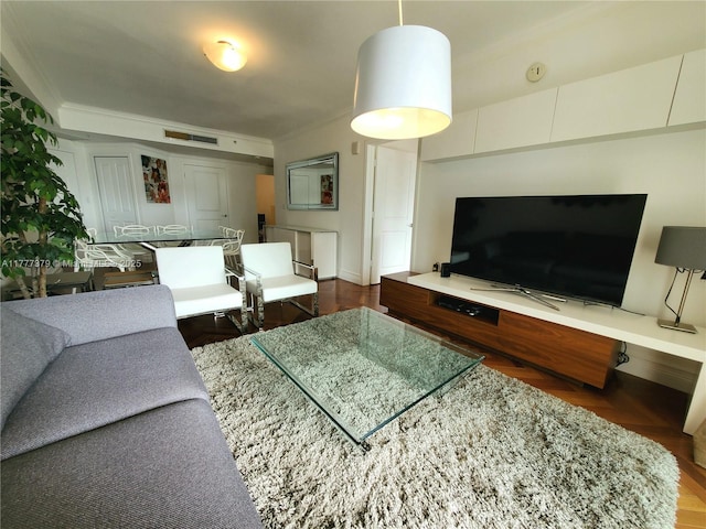 170 SE 14th St Unit 2705, Miami, FL 33131 - living room with ornamental molding, wood finished floors, and baseboards