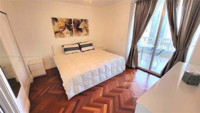 170 SE 14th St Unit 2705, Miami, FL 33131 - bedroom with crown molding, access to exterior, and baseboards