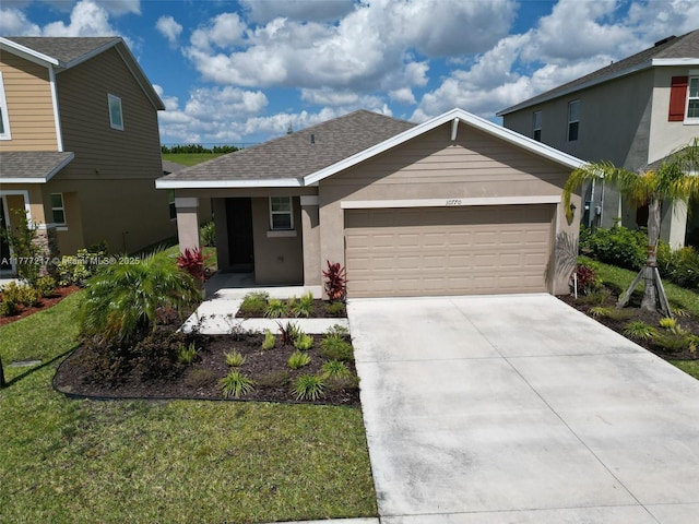 view of front of home with stucco siding, an attached garage, a shingled roof, and concrete driveway