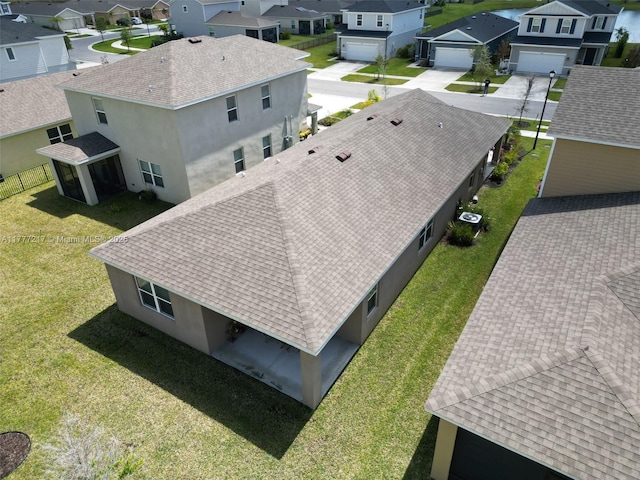birds eye view of property with a residential view