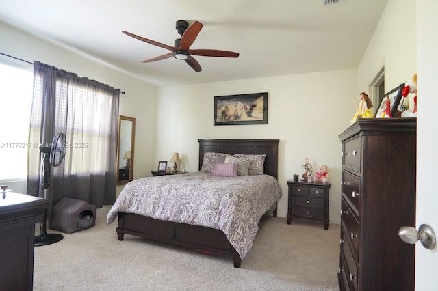 bedroom with carpet floors and a ceiling fan