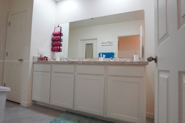 full bathroom featuring tile patterned flooring and double vanity