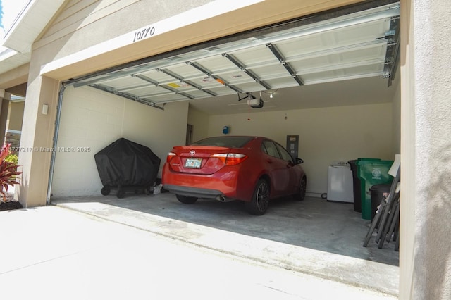 garage featuring a garage door opener