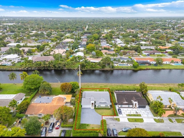 bird's eye view featuring a water view and a residential view