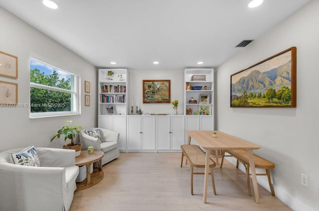 interior space featuring light wood-style flooring, visible vents, and recessed lighting