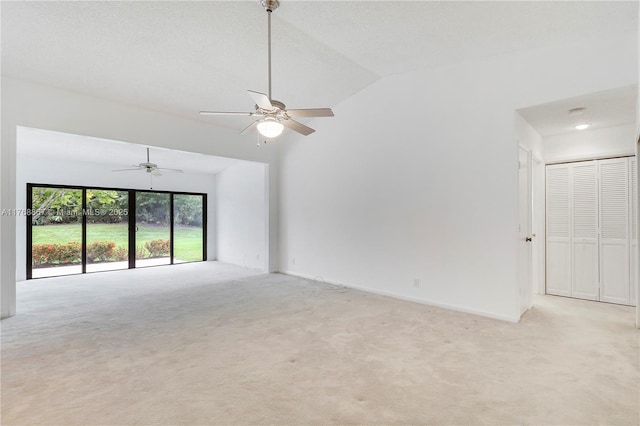 3774 SW Pheasant Run, Palm City, FL 34990 - empty room featuring light colored carpet, vaulted ceiling, and ceiling fan