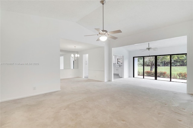 3774 SW Pheasant Run, Palm City, FL 34990 - unfurnished living room with carpet flooring, a chandelier, vaulted ceiling, ceiling fan, and baseboards