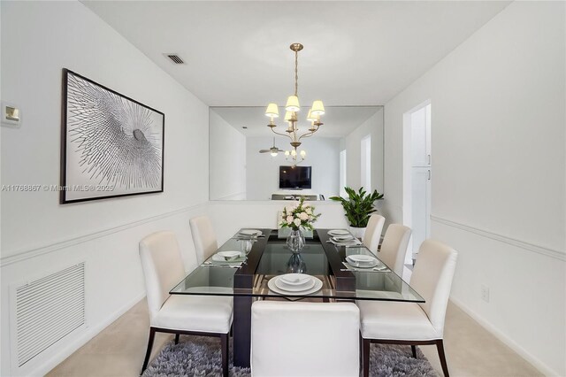 3774 SW Pheasant Run, Palm City, FL 34990 - dining space with a chandelier, carpet flooring, and baseboards