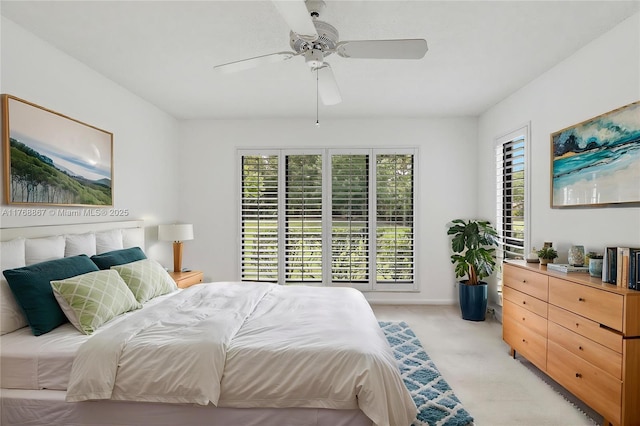 3774 SW Pheasant Run, Palm City, FL 34990 - bedroom with light carpet and a ceiling fan