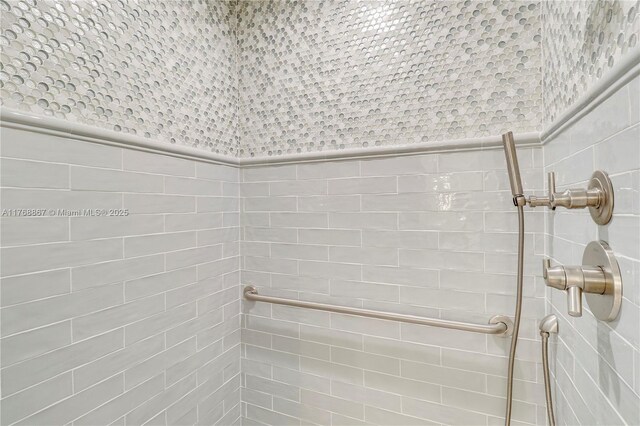3774 SW Pheasant Run, Palm City, FL 34990 - full bathroom with a tile shower