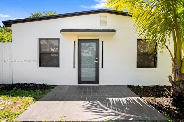 1640 NE 183rd St, North Miami Beach, FL 33179 - entrance to property featuring stucco siding and a patio