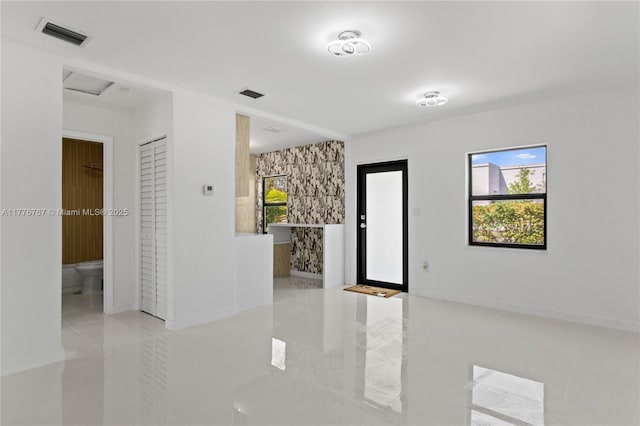 1640 NE 183rd St, North Miami Beach, FL 33179 - tiled foyer with baseboards and healthy amount of natural light