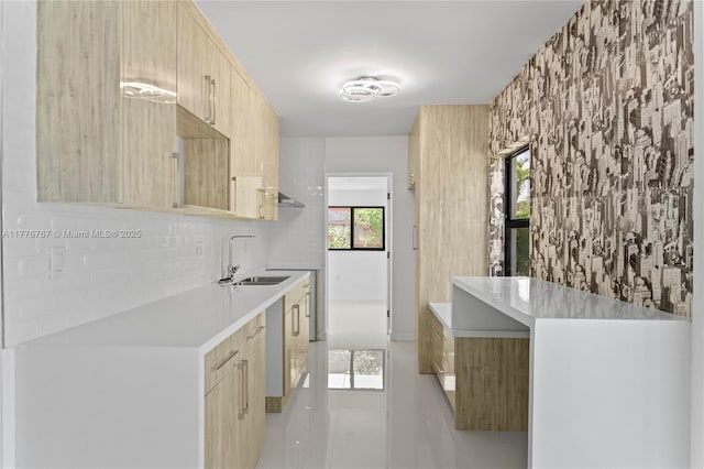 1640 NE 183rd St, North Miami Beach, FL 33179 - kitchen with light brown cabinets, a sink, light countertops, and modern cabinets