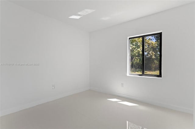1640 NE 183rd St, North Miami Beach, FL 33179 - empty room with light tile patterned floors and baseboards