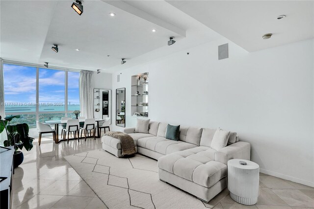 100 S Pointe Dr Unit 3102, Miami Beach, FL 33139 - living room featuring a water view, a wall of windows, recessed lighting, and baseboards
