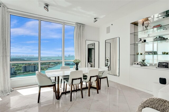 100 S Pointe Dr Unit 3102, Miami Beach, FL 33139 - dining area featuring healthy amount of natural light and a water view