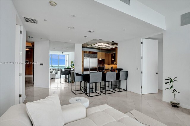 100 S Pointe Dr Unit 3102, Miami Beach, FL 33139 - living area featuring light tile patterned floors, recessed lighting, and a wall of windows