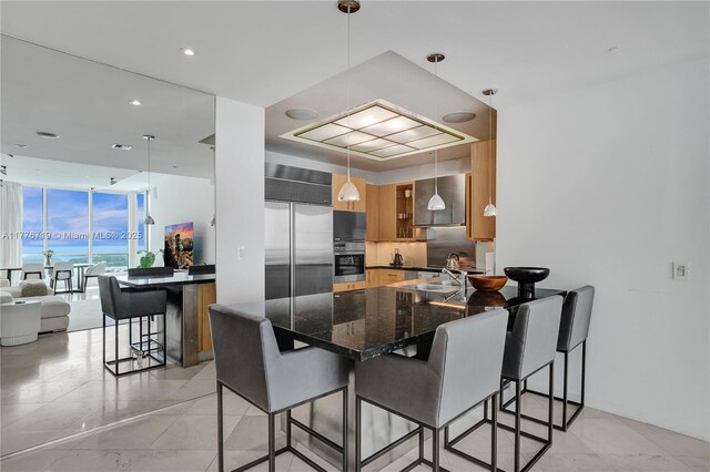 100 S Pointe Dr Unit 3102, Miami Beach, FL 33139 - dining space featuring light tile patterned flooring and floor to ceiling windows