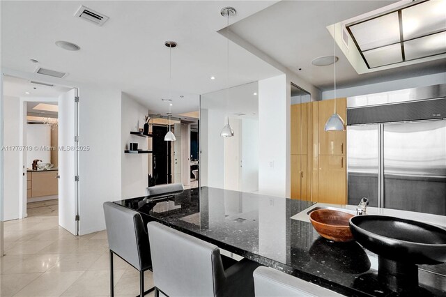 100 S Pointe Dr Unit 3102, Miami Beach, FL 33139 - kitchen featuring stainless steel built in refrigerator, dark stone counters, decorative light fixtures, light tile patterned floors, and modern cabinets