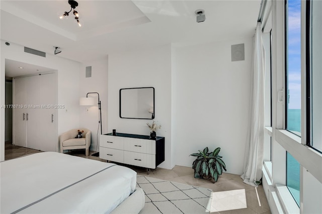 100 S Pointe Dr Unit 3102, Miami Beach, FL 33139 - bedroom with a raised ceiling and light tile patterned floors
