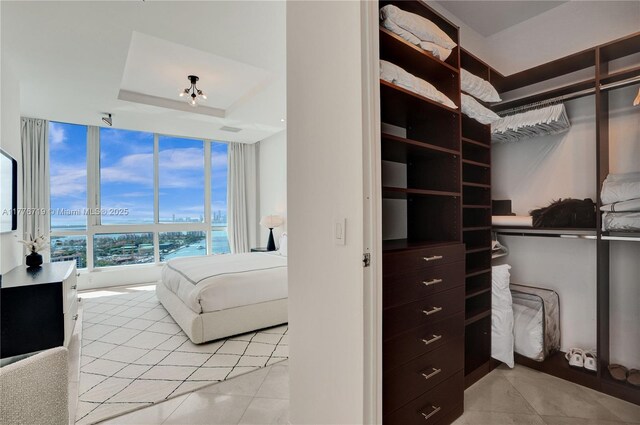 100 S Pointe Dr Unit 3102, Miami Beach, FL 33139 - spacious closet featuring light tile patterned floors and a raised ceiling