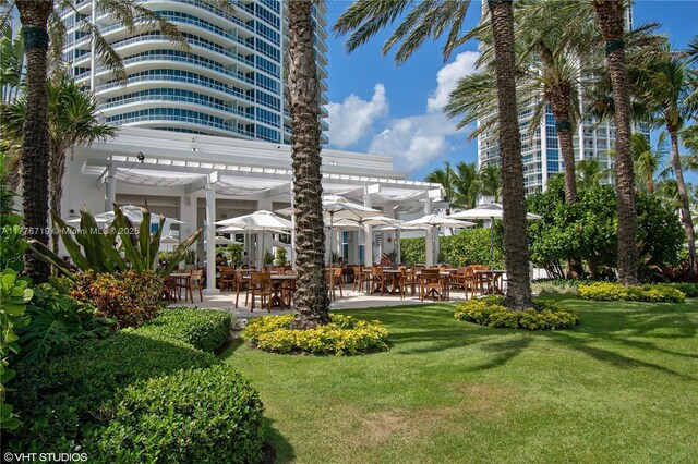 100 S Pointe Dr Unit 3102, Miami Beach, FL 33139 - view of grassy yard featuring a pergola, a patio, and outdoor dining area
