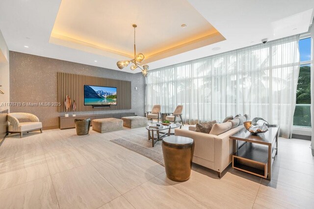 100 S Pointe Dr Unit 3102, Miami Beach, FL 33139 - living area with a tray ceiling and a chandelier