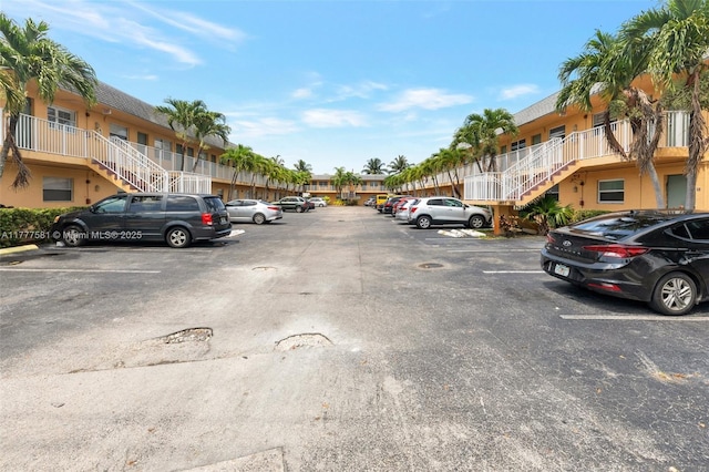 4061 N Dixie Hwy Unit 29, Oakland Park, FL 33334 - uncovered parking lot featuring stairs and a residential view