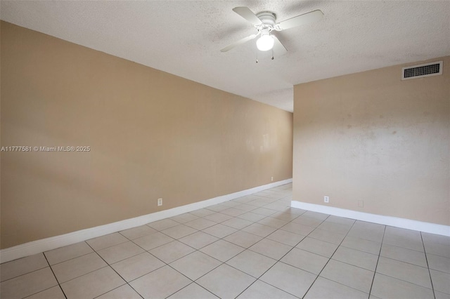 4061 N Dixie Hwy Unit 29, Oakland Park, FL 33334 - empty room with a textured ceiling, ceiling fan, light tile patterned floors, and baseboards