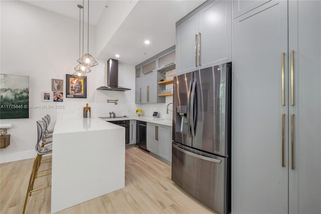 kitchen with open shelves, gray cabinetry, black appliances, and wall chimney range hood