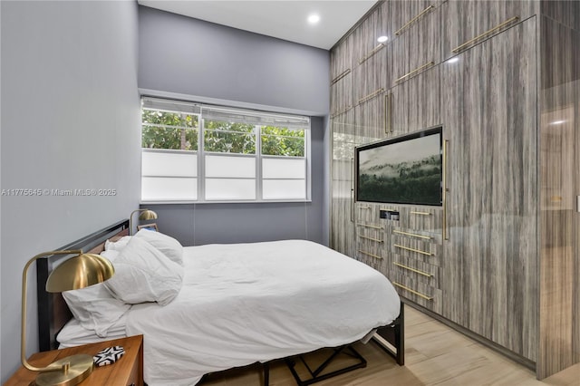 bedroom with light wood-type flooring