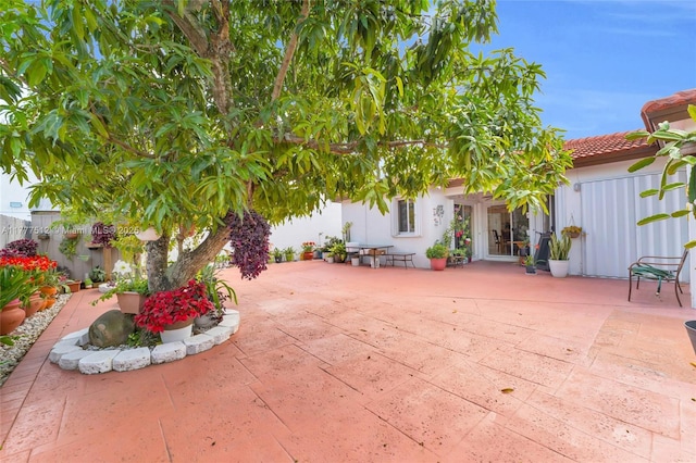view of patio / terrace featuring fence
