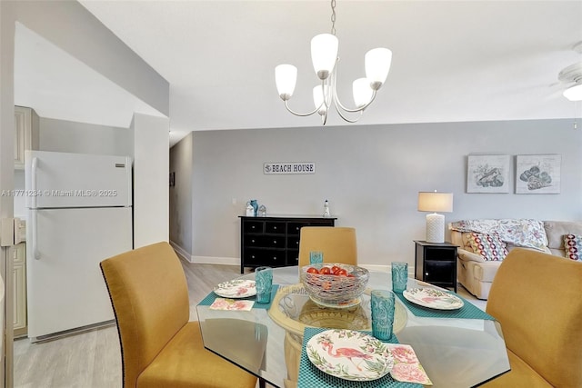 1936 S Ocean Dr Unit 2D, Hallandale Beach, FL 33009 - dining area featuring light wood-style floors, a chandelier, and baseboards