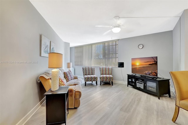 1936 S Ocean Dr Unit 2D, Hallandale Beach, FL 33009 - living room featuring wood finished floors, a ceiling fan, and baseboards