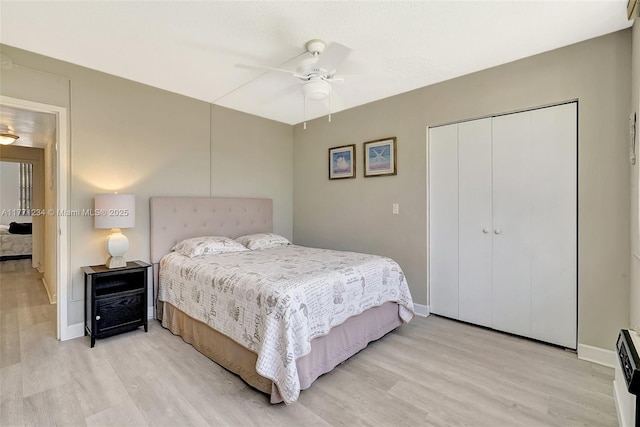 1936 S Ocean Dr Unit 2D, Hallandale Beach, FL 33009 - bedroom with light wood-type flooring, a closet, baseboards, and ceiling fan