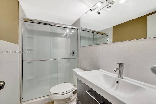 1936 S Ocean Dr Unit 2D, Hallandale Beach, FL 33009 - full bath with tile walls, a stall shower, vanity, and toilet