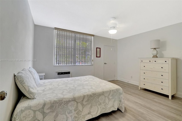 1936 S Ocean Dr Unit 2D, Hallandale Beach, FL 33009 - bedroom featuring wood finished floors, baseboards, and ceiling fan
