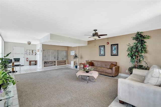 1936 S Ocean Dr Unit 2D, Hallandale Beach, FL 33009 - living area with light tile patterned floors, ceiling fan, baseboards, and light colored carpet