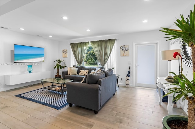11215 NE 4th Ave, Miami, FL 33161 - living area featuring light wood-style floors and recessed lighting