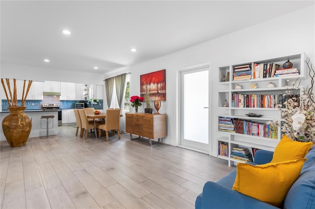 11215 NE 4th Ave, Miami, FL 33161 - living area with light wood-style flooring and recessed lighting
